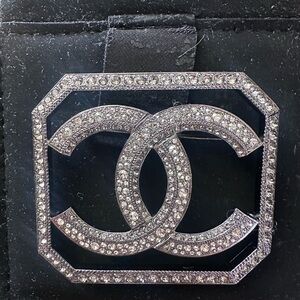 CHANEL Silver and Crystal Logo Brooch